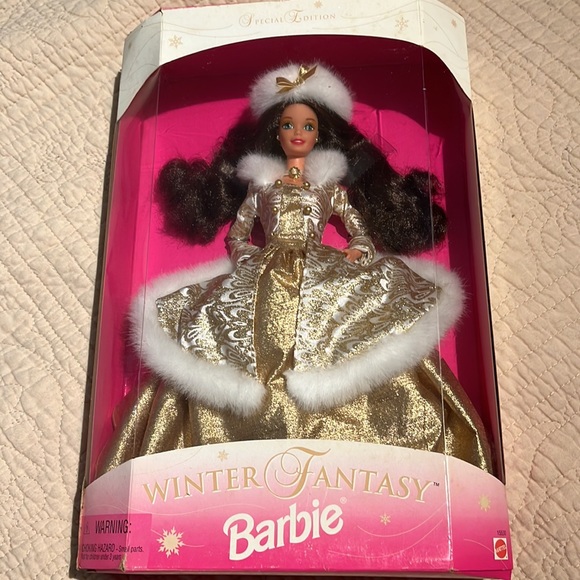 Barbie is a brunette in a gold winter gown trimmed in white fur. - Picture 3 of 4